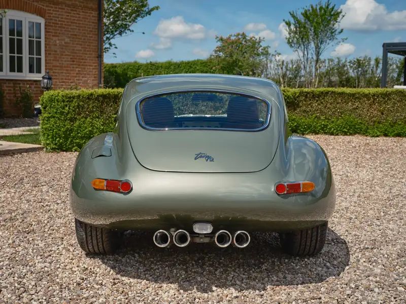 Rear three-quarter view with quad tailpipes