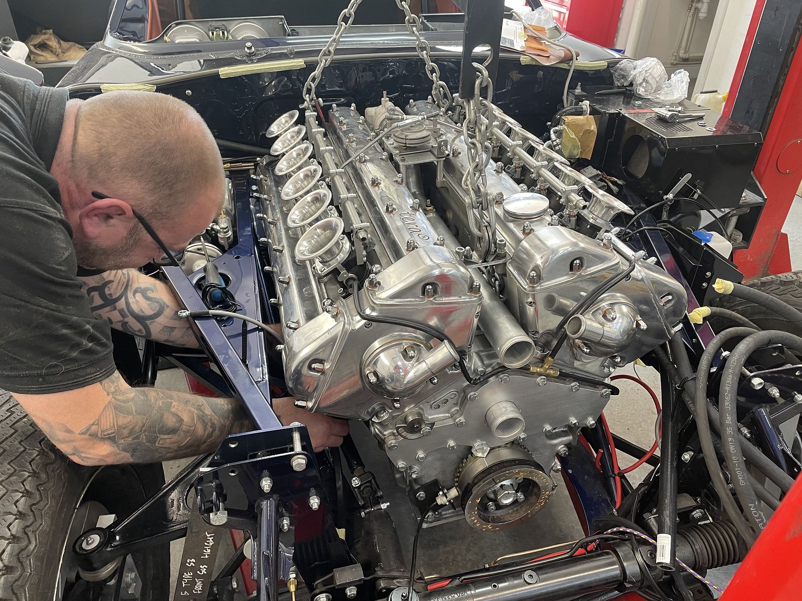 Donor straight-six engine being fitted in the workshop