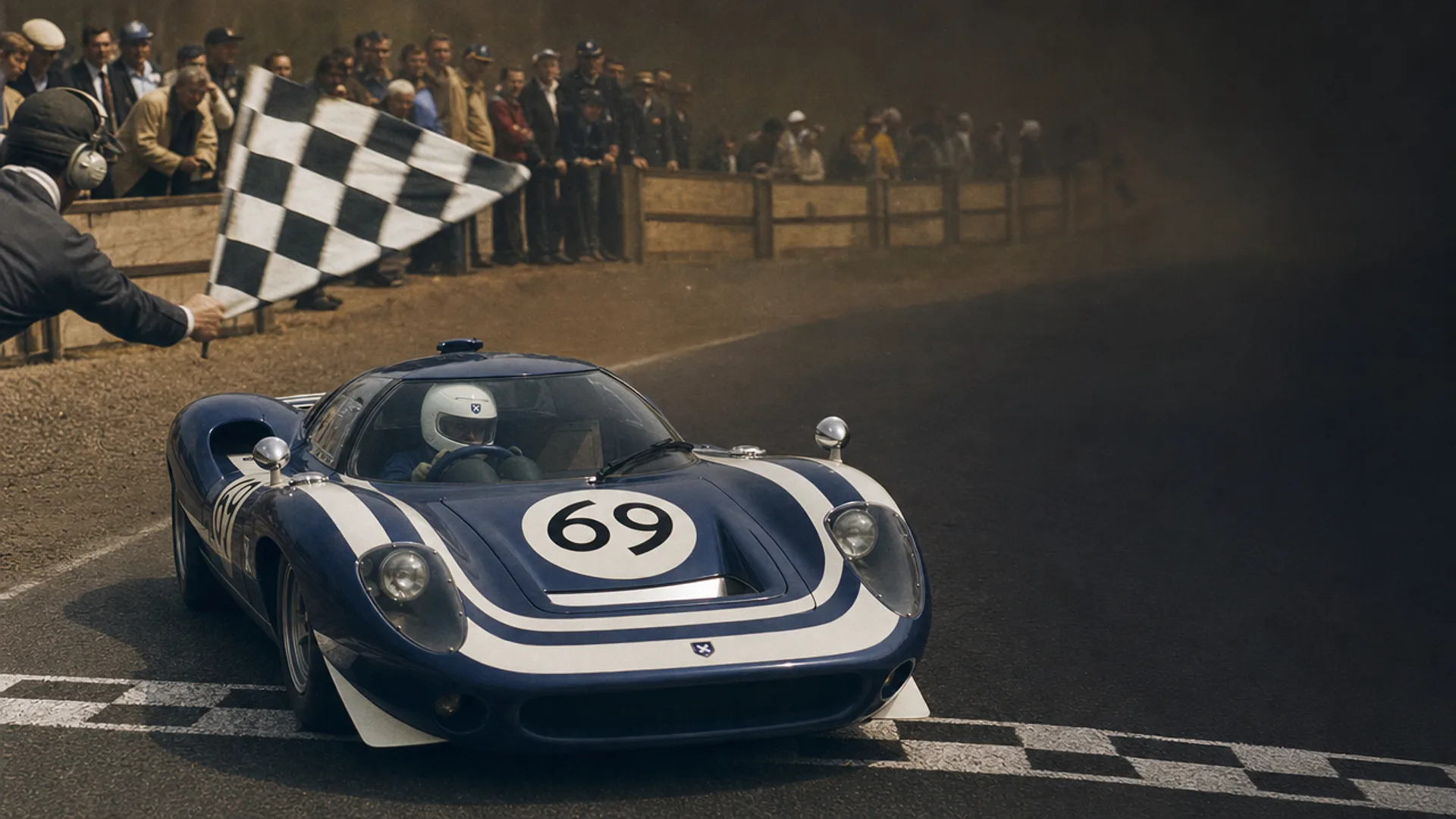 The LM69 crossing the finish line to the chequered flag