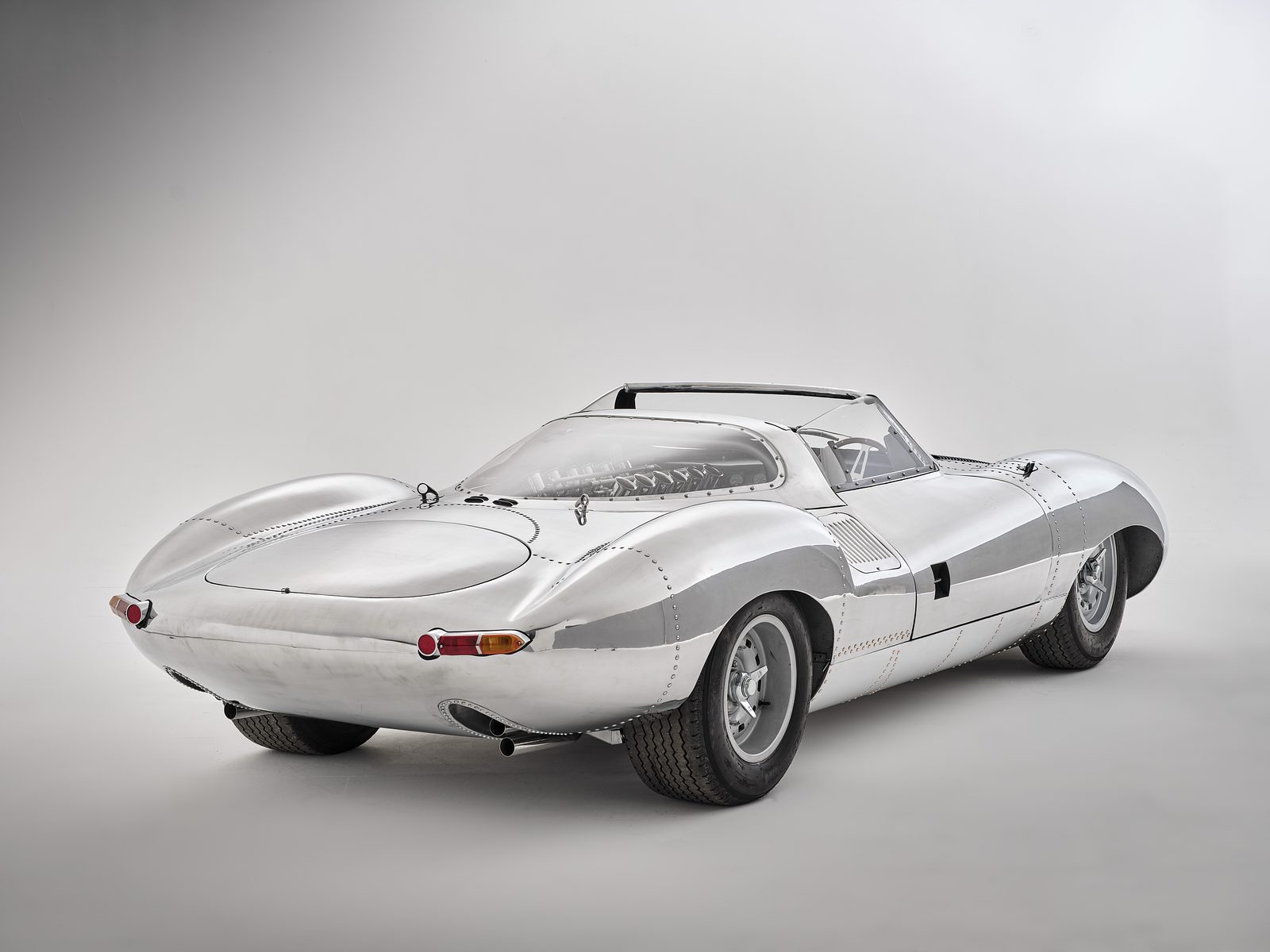 XJ13 Toolroom Copy — polished aluminium, rear three-quarter view